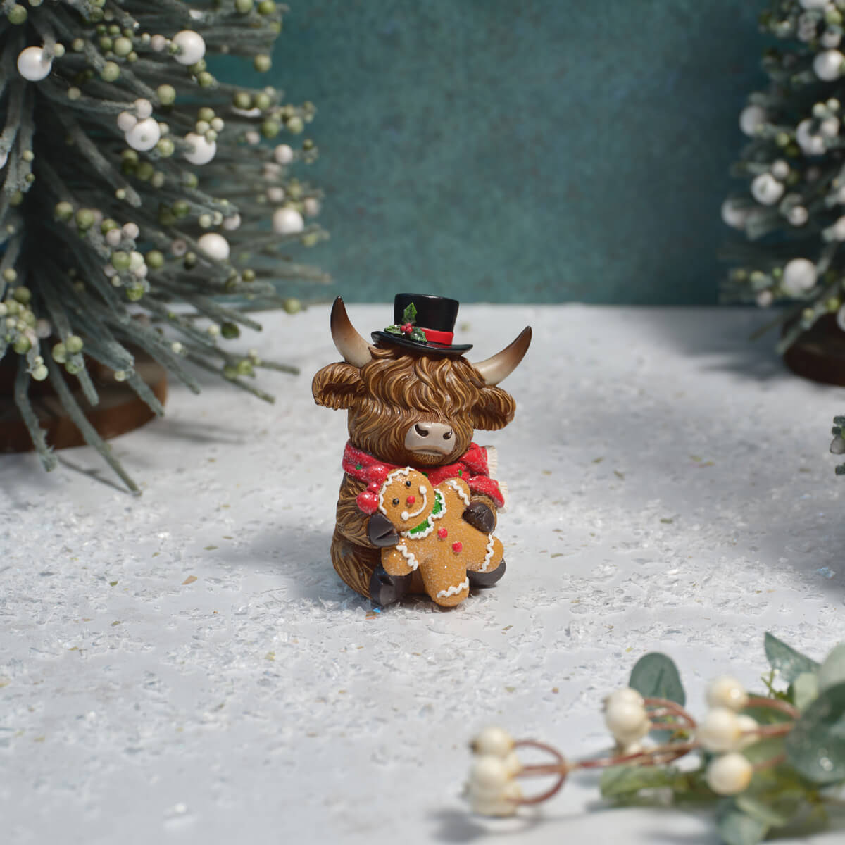 Highland Cow holding Gingerbread Ornament