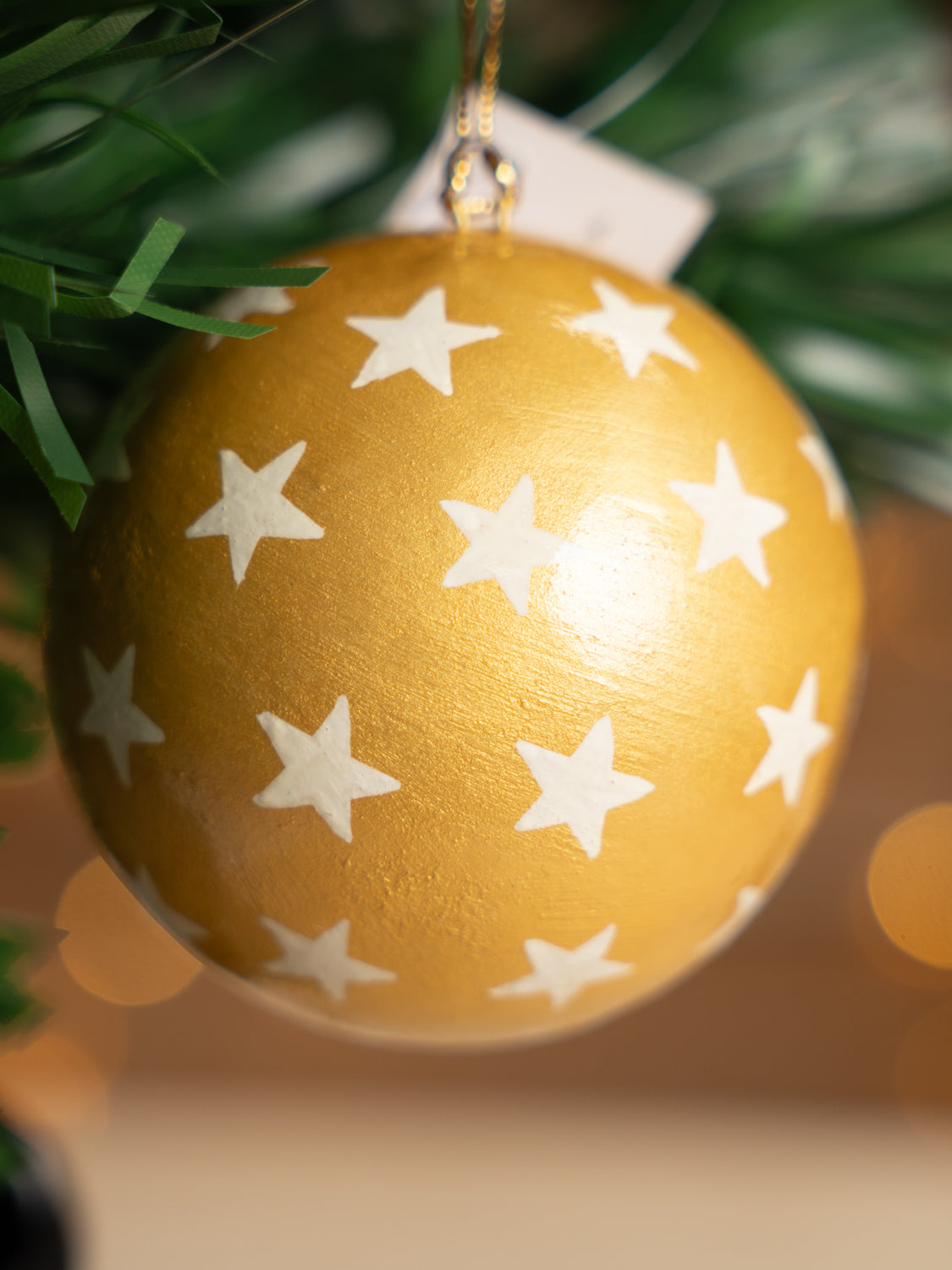White Stars on Gold Bauble